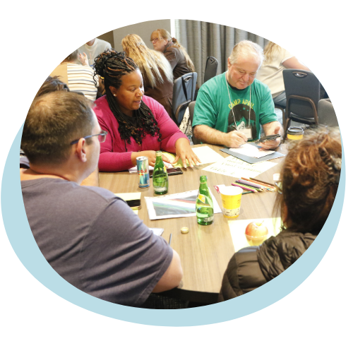 A group of APRIL Roundtable participants speak with one another. 